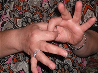 A picture showing two hands making a gesture symbolising liaison, link
